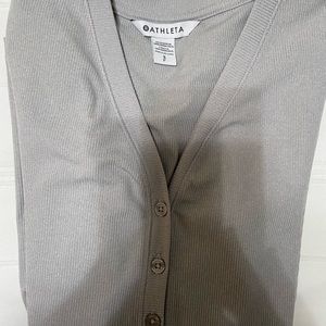 Athleta long sleeve Ladies Small with 4 buttons. A beautiful light gray color.